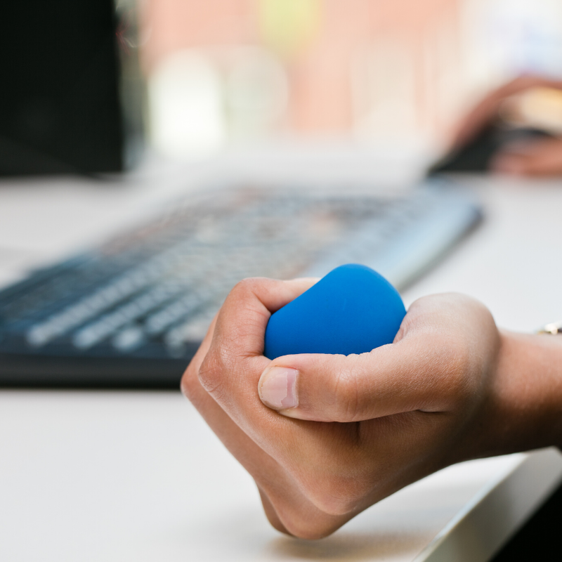 Hand clutching a stress ball